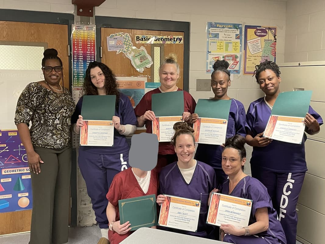 DRMI participants posing together in a women-focused program setting.